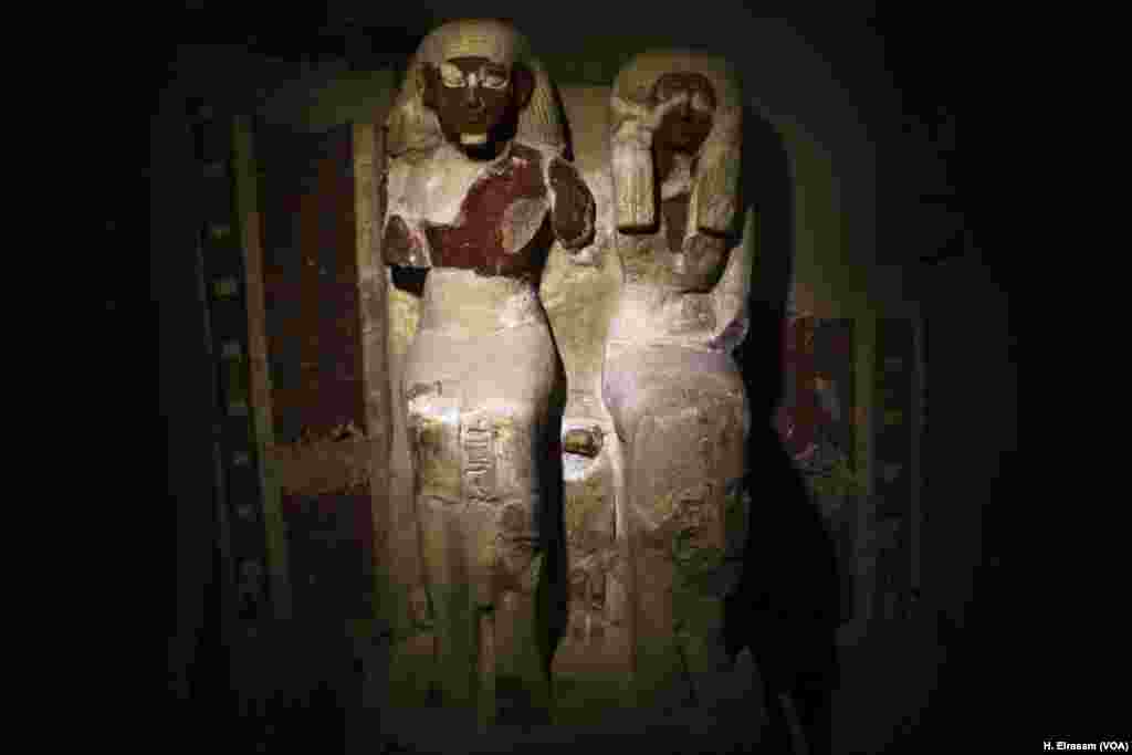A statue of Amenemhat sits next to that of his wife, wearing a long dress and wig, on a high back chair. Between their legs stands, in a smaller scale, a figure of one of their sons, in Luxor, Egypt, Sept. 9, 2017.