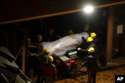 The 'Pillar of Shame' statue, a memorial to those killed in the 1989 Tiananmen crackdown, is removed from the University of Hong Kong, Dec. 23, 2021.