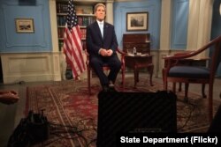 U.S. Secretary of State John Kerry settles into his chair in a studio at the Department of State in Washington, D.C., before appearing on the MSNBC program "Morning Joe" on July 17, 2015, to discuss the E.U./P5+1/U.S.-Iranian nuclear deal.