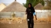 Salma al-Majidi, diakui oleh FIFA sebagai wanita Arab dan Sudan pertama yang melatih tim sepak bola pria di dunia Arab. (Foto: AFP / Ashraf Shazly)