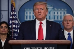 U.S. President Donald Trump addresses the daily coronavirus response briefing as Seema Verma, administrator of the Centers for Medicare & Medicaid Services, and Vice President Mike Pence look on at the White House in Washington, March 18, 2020.