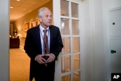 FILE - White House trade adviser Peter Navarro arrives for a news conference in the Rose Garden at the White House, June 7, 2018.