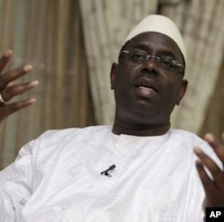 Senegalese presidential candidate and former Prime Minister Macky Sall speaks to journalists during an interview at his home in Dakar, Saturday, March 24, 2012.