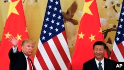 美國總統川普去年訪華時與中國國家主席習近平會面。