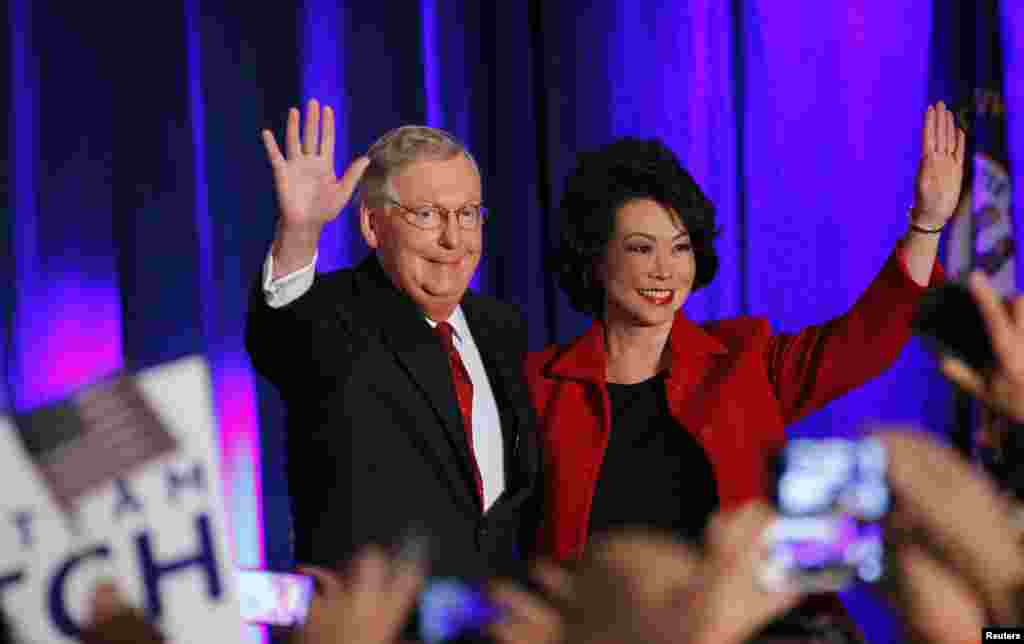 In Kentucky, Republican Mitch McConnell gets elected to a sixth term and will become majority leader in January. He and wife Elaine Chao, former U.S. labor secretary, greet supporters in Louisville, Nov. 4, 2014. 