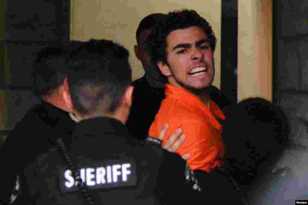 Luigi Mangione, 26, a suspect in the New York City killing of UnitedHealth executive Brian Thompson, arrives for an extradition hearing at Blair County Court House in Hollidaysburg, Pennsylvania, Dec. 10, 2024.