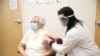 A woman gets a coronavirus vaccine at a CVS pharmacy, which has started a sweepstakes campaign for people who sign up for the vaccine. (Photo courtesy of CVS) 