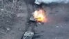 Smoke and fire rise from Russian vehicle during fighting near Synkivka