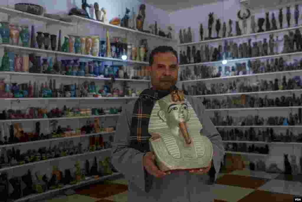 Despite the tourism boom, Abu Aish, an alabaster vendor, says people "are buying fewer and smaller souvenirs. Our profits are minimal.” (Hamada Elrasam/VOA)