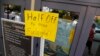 FILE - A sign at a fitness studio advertises a deal for furloughed government workers in the Capitol Hill neighborhood in Washington, Oct. 5, 2013. A government shutdown can hurt local businesses, said Ellen Zentner of the American Bankers Association.