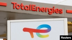 FILE - TotalEnergies signs at a petrol station in Nice, France, on Oct. 10, 2022. The human rights and environmental group Global Witness accused the company this week of intimidation tactics by its East African Crude Oil Pipeline project. TotalEnergies has denied the allegation.