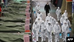 Para petugas mengenakan pakaian khusus saat akan menyemprotkan disinfektan di sebuah pasar di kota tenggara Daegu sebagai tindakan pencegahan saaat merebaknya wabah korona di Korea Selatan, 23 Februari 2020. 