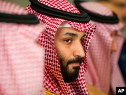 FILE - Saudi Crown Prince Mohammed bin Salman meets with U.S. Defense Secretary Jim Mattis at the Pentagon in Washington, March 22, 2018.