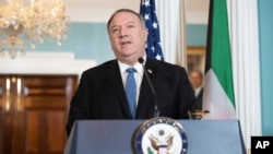 Secretary of State Mike Pompeo speaks to the media prior to meeting with Kuwaiti Foreign Minister Sheikh Ahmad Nasser Al-Mohammad Al-Sabah at the State Department, Tuesday, Nov. 24, 2020 in Washington. (Saul Loeb/Pool via AP)