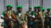 FILE - The first Rwandan soldiers who are part of the African Union peacekeeping force in the Central African Republic (MISCA) prepare to receive a welcome speech by their superiors shortly after landing at the airport of the capital Bangui.