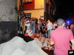 People react after an explosion in Gaziantep, southeastern Turkey, Aug. 21, 2016.