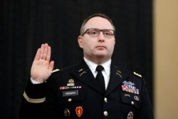 National Security Council aide Lt. Col. Alexander Vindman is sworn in to testify before the House Intelligence Committee on Capitol Hill in Washington, Nov. 19, 2019.