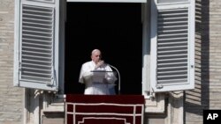Pope Francis delivers the Angelus noon prayer in St. Peter's Square at the Vatican, Nov. 1, 2020.