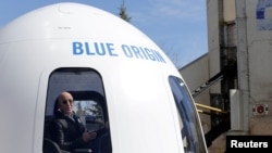 FILE - Amazon and Blue Origin founder Jeff Bezos addresses the media about the New Shepard rocket booster in Colorado Springs, Colorado, April 5, 2017. 