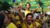FILE - Soccer fans celebrate as they watch on a big screen television, the second goal scored by Brazil's Neymar in the World Cup match against Cameroon, in Manaus, Brazil.