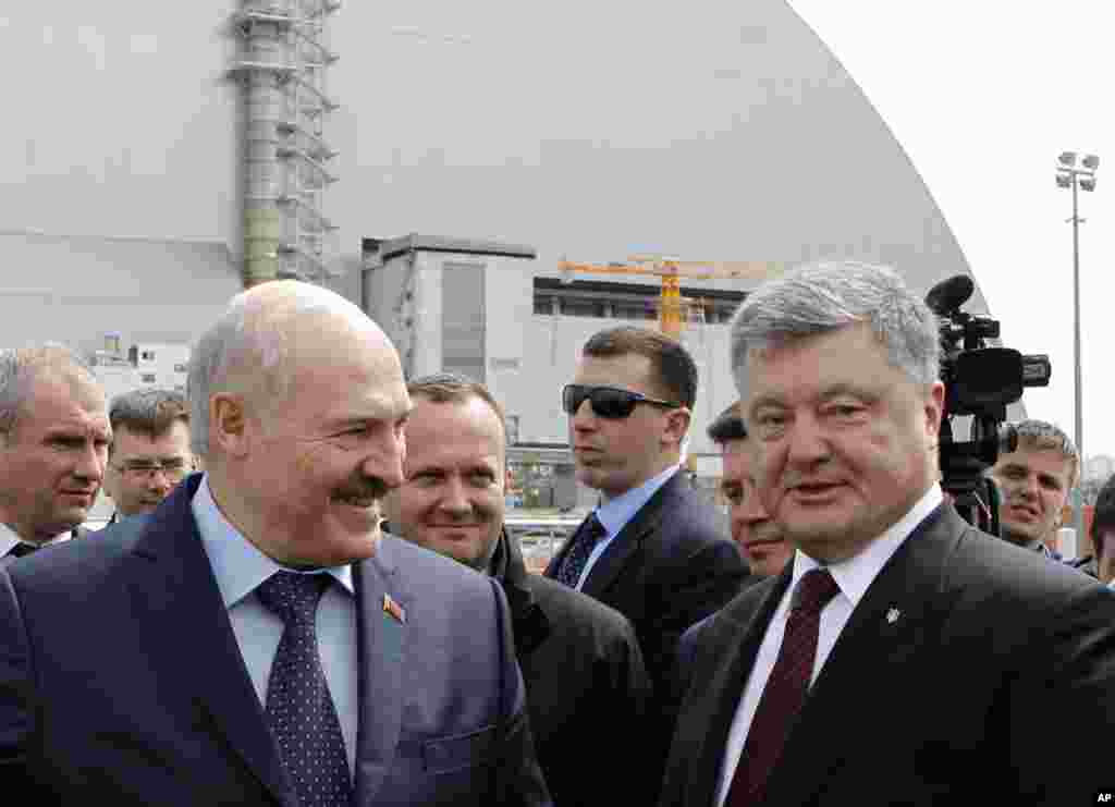 Ukrainian President Petro Poroshenko, right, and Belarus President Alexander Lukashenko visit the Chernobyl nuclear power plant in Chernobyl, Ukraine, April 26, 2017. April 26 marks the 31st anniversary of the Chernobyl nuclear disaster.