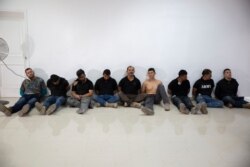 Suspects in the assassination of Haiti's President Jovenel Moise are shown to the media at the General Direction of the police in Port-au-Prince, Haiti, July 8, 2021.