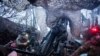 FILE - Ukrainian servicemen of 148th artillery brigade fire by a M777 howitzer towards Russian positions at the frontline on Velyka Novosilka direction, Donetsk region, Ukraine, Jan. 26, 2025.