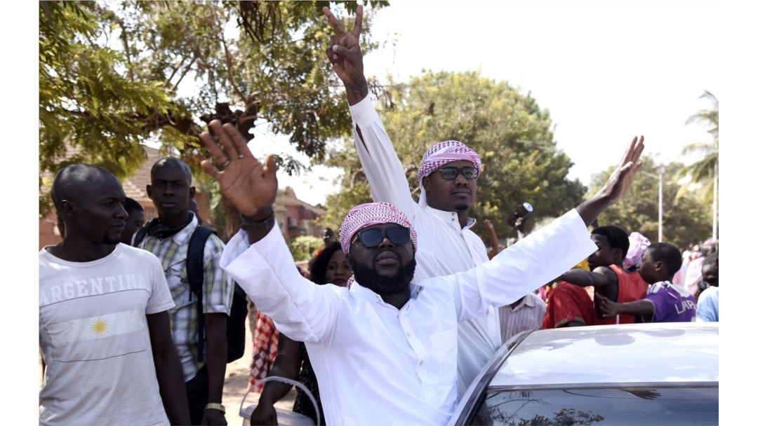Supporters of newly elected President Umaro Sissoco Embalo celebrate, Jan. 1, 2020, in Bissau, Guinea-Bissau, after the anouncement of the election results.