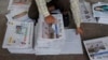 FILE - A Bangladeshi worker classifies newspapers, in Dhaka, Bangladesh, Feb. 20, 2016. Under Section 57 of Bangladesh’s Information and Communications Technology Act, journalists can be jailed for a variety of offenses, such as defamation, hurting religious sentiment, and tarnishing the image of the state or an individual. 
