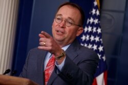 FILE - White House chief of staff Mick Mulvaney talks to the press at the White House, Oct. 17, 2019.