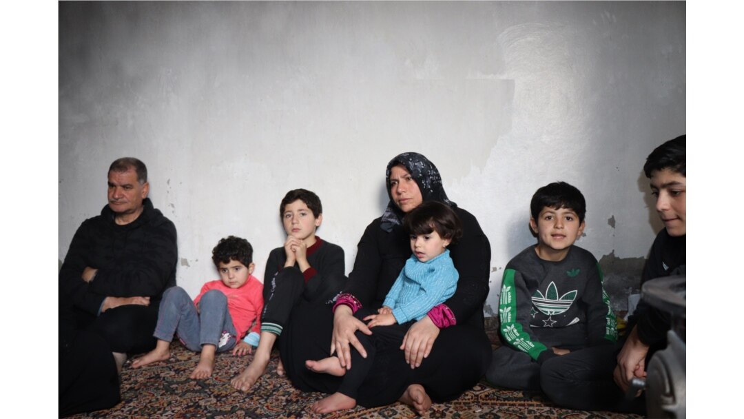 Abeel, 36, with her children who all fled from Idlib a week ago during the night, are seen in Raqqa, Syria, Feb. 23, 2020. (Heather Murdock/VOA)