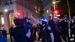 A police officer shouts at Associated Press videojournalist Robert Bumsted on June 2, 2020, in New York. 