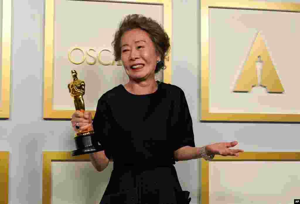 Yuh-Jung Youn, winner of the award for best actress in a supporting role for "Minari," poses in the press room at the Oscars on Sunday, April 25, 2021, at Union Station in Los Angeles. (AP Photo/Chris Pizzello, Pool)