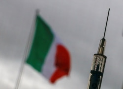 FILE - A syringe with a dose of the AstraZeneca vaccine against the coronavirus disease is seen in a vaccination center at the Cecchignola military compound, in Rome, Italy, March 9, 2021.