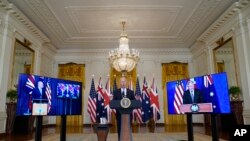 President Joe Biden, joined virtually by Australian Prime Minister Scott Morrison and British Prime Minister Boris Johnson, speaks about a national security initiative from the East Room of the White House in Washington, Wednesday, Sept. 15, 2021. (AP Photo/Andrew Harnik)