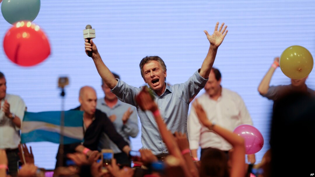 Opposition presidential candidate Mauricio Macri celebrates his victory with supporters at his campaign headquarters in Buenos Aires, Argentina, Nov. 22, 2015