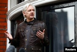 FILE - WikiLeaks founder Julian Assange is seen on the balcony of the Ecuadorian Embassy in London, Britain, May 19, 2017.