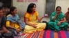 Indian physician Aparna Hegde meets with villagers in Solapur, Maharashtra state, to explain how mobile technology can improve health care. 