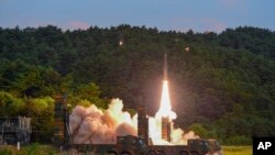 In this photo provided by South Korea Defense Ministry, a Hyunmoo II ballistic missile is fired during an exercise at an undisclosed location in South Korea, Sept. 4, 2017. 