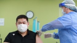 FILE - Mongolian Prime Minister Oyun-Erdene Luvsannamsrai receives his first dose of the AstraZeneca/Oxford Covid-19 vaccine at a hospital in Ulaanbaatar, the capital of Mongolia on Feb. 23, 2021.