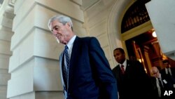 FILE - Former FBI Director Robert Mueller, the special counsel probing Russian interference in the 2016 election, departs Capitol Hill, June 21, 2017.