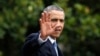 FILE - President Barack Obama waves as he walks towards Marine One on the South Lawn at the White House in Washington.
