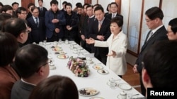 FILE - South Korean President Park Geun-hye speaks during a meeting with reporters at the Presidential Blue House in Seoul, South Korea, in this handout picture provided by the Presidential Blue House and released by Yonhap, Jan. 1, 2017.