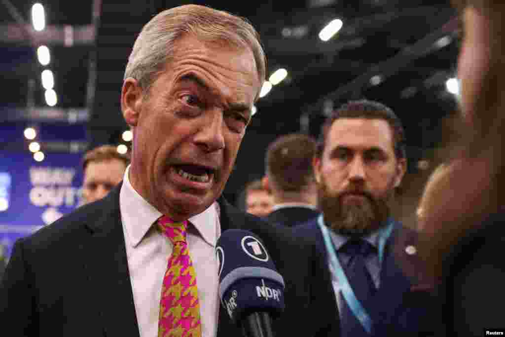 Reform UK party leader Nigel Farage speaks to the media at the Britain's Reform UK party's national conference in Birmingham, Britain.