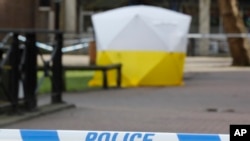 A police tent covers the spot in Salisbury, Britain, March 6, 2018, where former Russian double agent Sergei Skripal and his daughter Yulia were found critically ill Sunday following a suspected exposure to an 'unknown substance.'