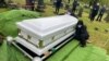 Wogene Debele of Takoma Park, Maryland, was eight months pregnant when she fell ill. She died from coronavirus shortly after giving birth. Here, her family mourns at her graveside. 