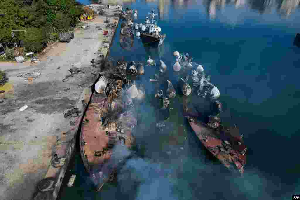 An aerial photo shows Syrian naval ships destroyed during an overnight Israeli attack on the port city of Latakia. The U.N. special envoy for Syria called on Israel to halt its military movements and bombardments inside Syria, days after the fall of president Bashar al-Assad.