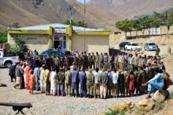 FILE - Militiamen loyal to Ahmad Massoud take part in a training exercise in Panjshir province, northeastern Afghanistan, Aug. 30, 2021.