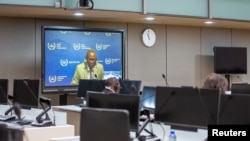 FILE - Sudanese war crimes suspect Ali Kushayb is seen on a screen during an initial appearance at the International Criminal Court in The Hague, Netherlands, June 15, 2020.