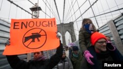 Demonstrators participate in an anti-gun violence rally sponsored by One Million Moms for Gun Control in New York, Jan. 21, 2013. 